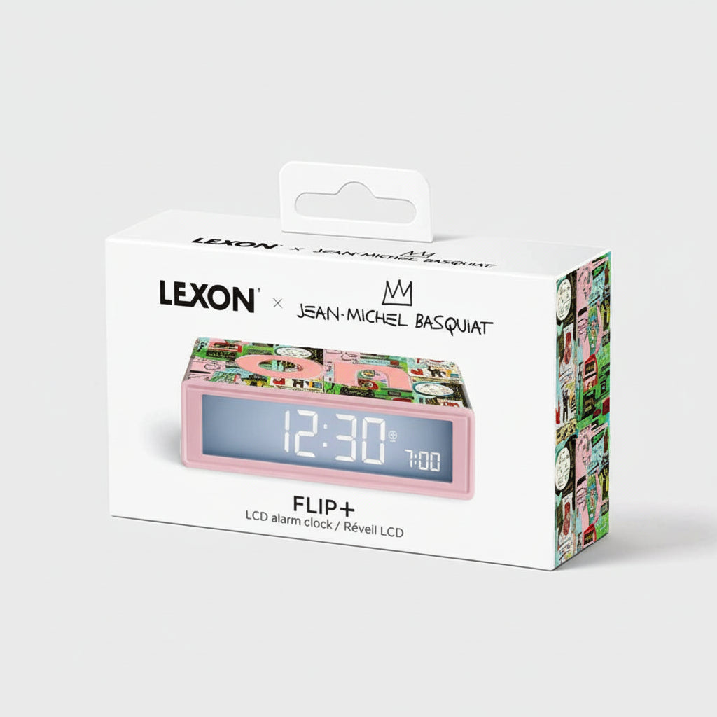 onherre mağazasından Lexon Flip+ x Jean-Michel Basquiat özel koleksiyon, "In Italian" desenli ters çevrilebilir LCD alarm saati.