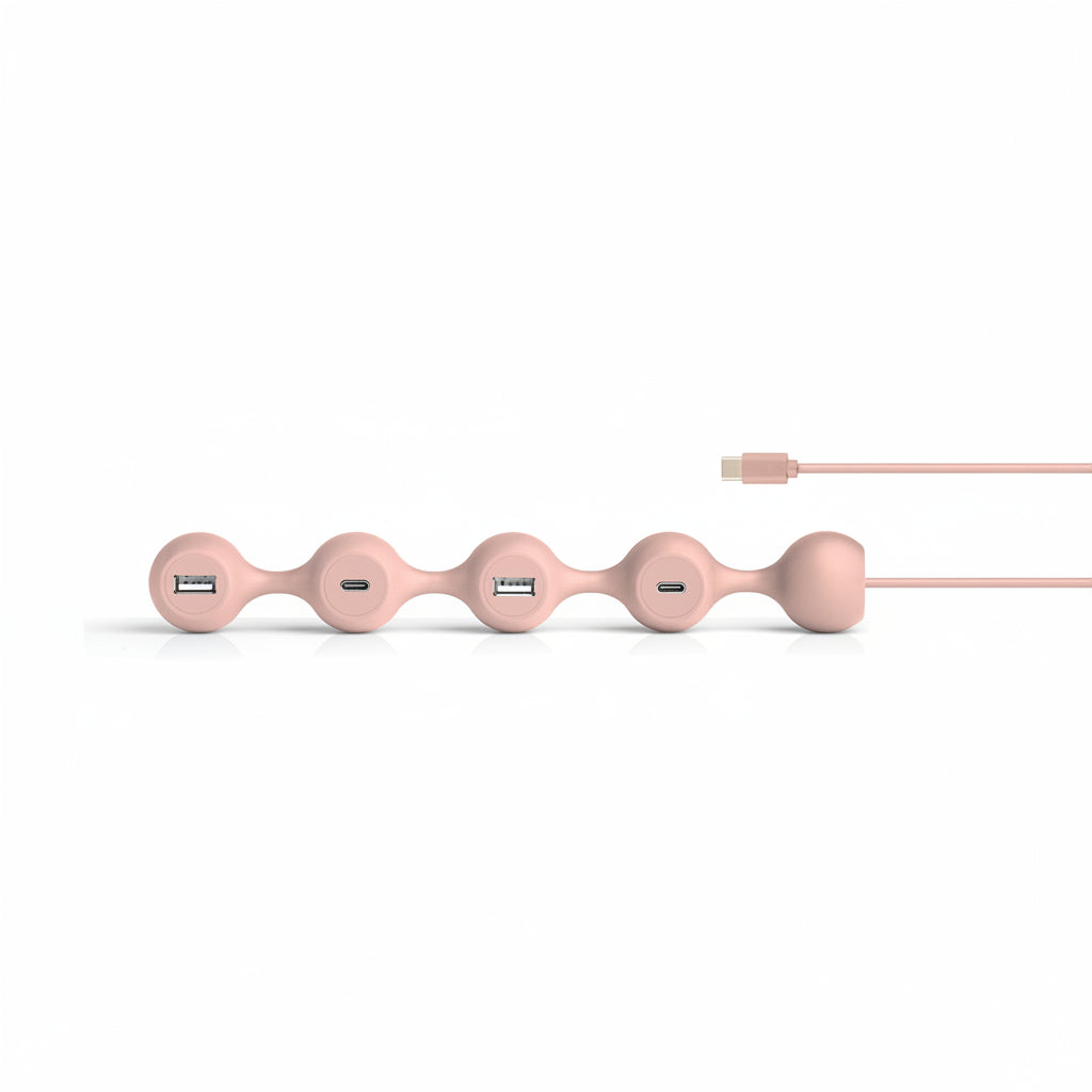 Bonherre mağazasından Lexon Peas Hub C, pembe silikon gövdeli, 2 USB-C ve 2 USB-A girişli lüks esnek USB çoklayıcı.